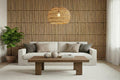 Modern living room with a white sofa, wooden coffee table, and decorative items.